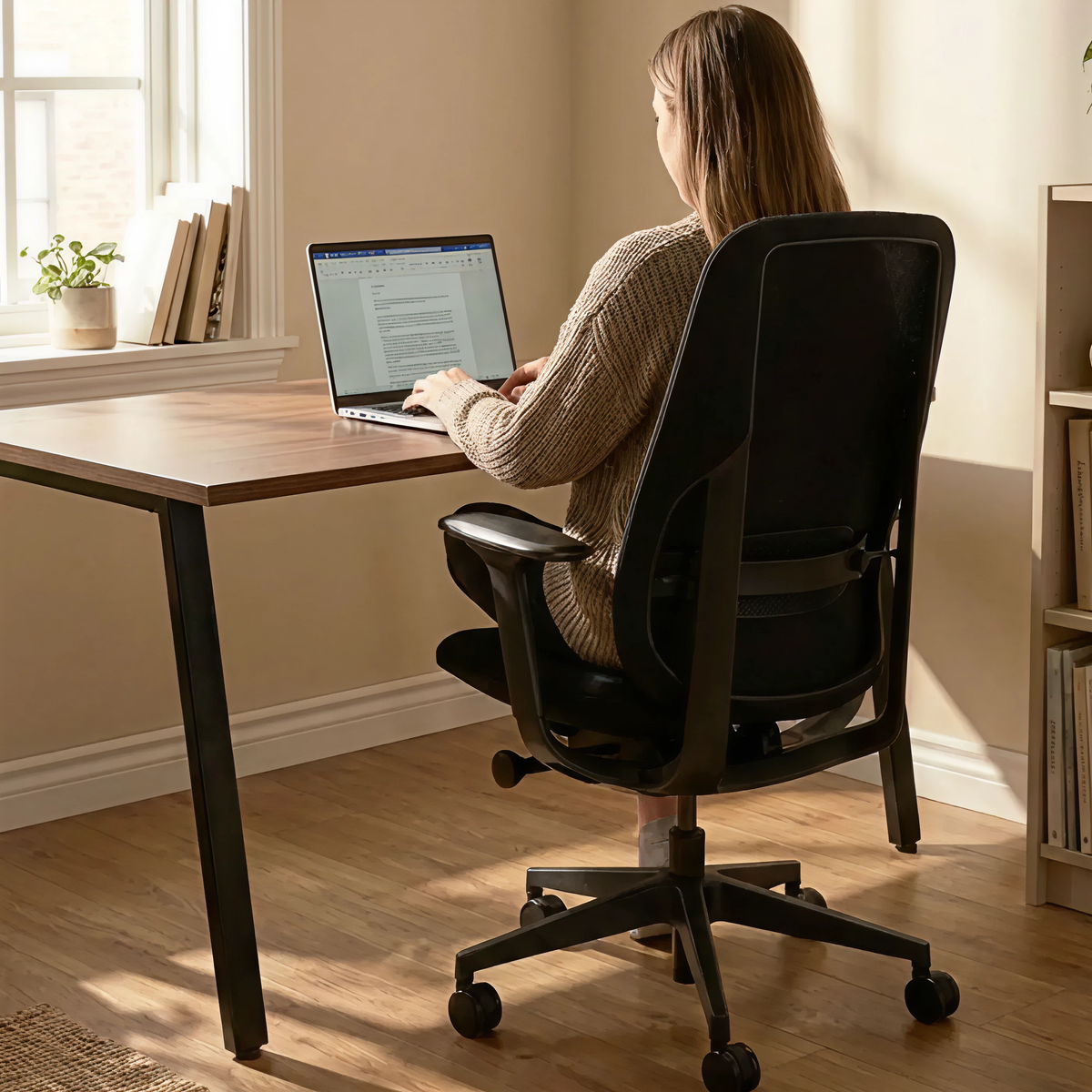 Woman working at a desk with office chair